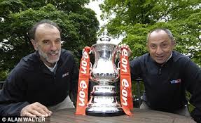 image of a Ossie and Ricky with the FA Cup in recent years.